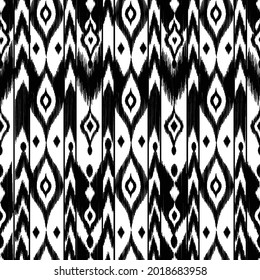 Ikat pattern silk fabric - traditional textile product in Uzbekistan, Cental Asia. Black and white