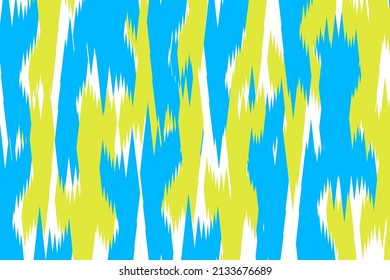 Ikat pattern traditional silk fabric. Handmade textile product yellow white blue. Using in fashion industry, rug, carpet, wallpaper, clothing, wrapping, fabric, cover, textile, tapestry
