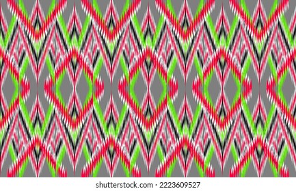 Ikat pattern.Abstract ethnic fabric pattern.Multicolored geometric tribal pattern.Grey background zigzag pattern.Illustration of embroidery.carpet design wallpaper.clothing,wrapping,knitwear design