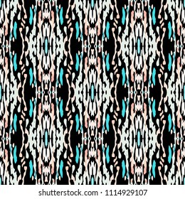 Ikat print in modern style, shibori fabric design. Tribal ethnic seamless pattern. Vintage endless repeat ornament. Traditional folk ikat texture. Vector watercolor paint splash background.