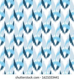 Ikat seamless colorful  geometric pattern. Abstract background texture.