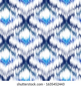 Ikat seamless colorful  geometric pattern. Abstract background texture.