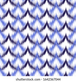 Ikat seamless colorful  geometric pattern. Abstract background texture.