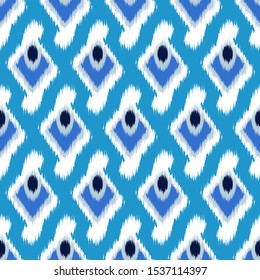 Ikat  seamless  geometric pattern. Abstract background texture.
