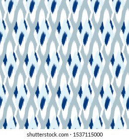 Ikat  seamless  geometric pattern. Abstract background texture.
