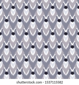 Ikat  seamless  geometric pattern. Abstract background texture.

