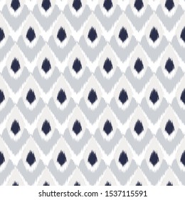 Ikat  seamless  geometric pattern. Abstract background texture.
