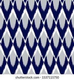 Ikat  seamless  geometric pattern. Abstract background texture.
