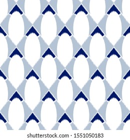 Ikat  seamless  geometric pattern. Abstract background texture.
