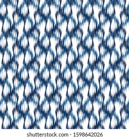 Ikat seamless geometric pattern. Abstract graphic background texture.