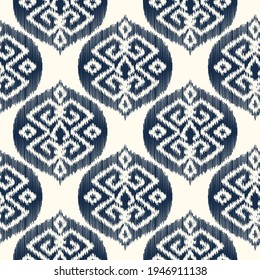 Ikat seamless ogee vector pattern. Aztec tribal abstract modern textile print. Damask style background with stripes and chevron. Ethnic watercolor fabric. Boho geometric fashion design.