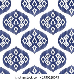Ikat seamless ogee vector pattern. Aztec tribal abstract modern textile print. Damask style background with stripes and chevron. Ethnic watercolor fabric. Boho geometric fashion design.