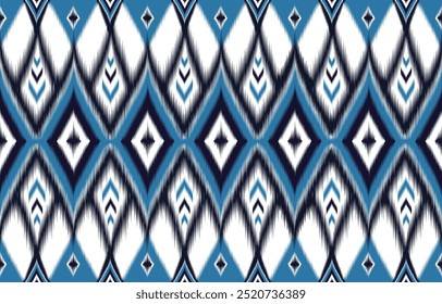 Ikat seamless pattern. Blue white geometric print. Abstract ethnic background. Navy ornament design. Trendy textile texture. Vintage boho wallpaper. Modern chevron style. Zigzag fabric. Ikat decor.