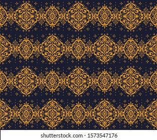 Ikat seamless pattern. Border with snowflakes. Openwork lace. New year Christmas background. Vector tie dye shibori print with stripes and chevron. Ink textured japanese background. Bohemian fashion. 