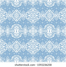 Ikat seamless pattern. Border with snowflakes. Openwork lace. New year Christmas background. Vector tie dye shibori print with stripes and chevron. Ink textured japanese background. Bohemian fashion. 