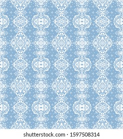 Ikat seamless pattern. Border with snowflakes. Openwork lace. New year Christmas background. Vector tie dye shibori print with stripes and chevron. Ink textured japanese background. Bohemian fashion. 