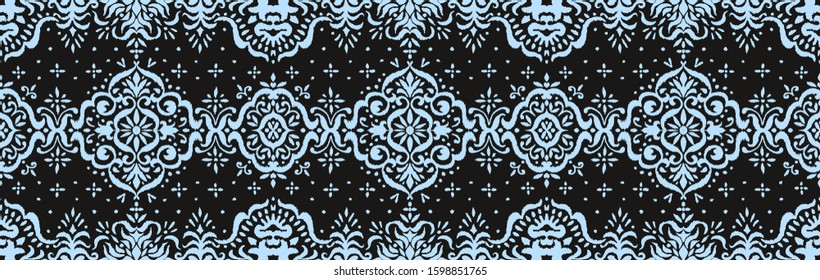 Ikat seamless pattern. Border with snowflakes. Openwork lace. New year Christmas background. Vector tie dye shibori print with stripes and chevron. Ink textured japanese background. Bohemian fashion. 
