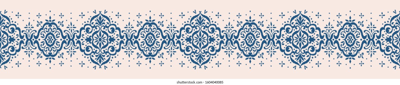 Ikat seamless pattern. Border with snowflakes. Openwork lace. New year Christmas background. Vector tie dye shibori print with stripes and chevron. Ink textured japanese background. Bohemian fashion. 