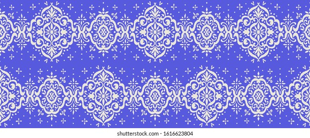 Ikat seamless pattern. Border with snowflakes. Openwork lace. New year Christmas background. Vector tie dye shibori print with stripes and chevron. Ink textured japanese background. Bohemian fashion. 