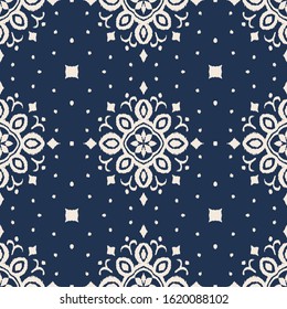 Ikat seamless pattern. Border with snowflakes. Openwork lace. New year Christmas background. Vector tie dye shibori print with stripes and chevron. Ink textured japanese background. Bohemian fashion. 