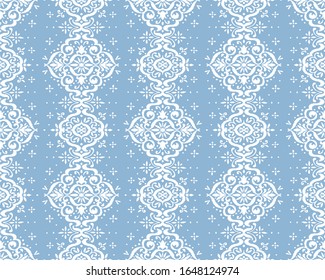 Ikat seamless pattern. Border with snowflakes. Openwork lace. New year Christmas background. Vector tie dye shibori print with stripes and chevron. Ink textured japanese background. Bohemian fashion. 