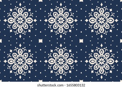 Ikat seamless pattern. Border with snowflakes. Openwork lace. New year Christmas background. Vector tie dye shibori print with stripes and chevron. Ink textured japanese background. Bohemian fashion. 