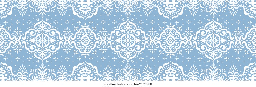 Ikat seamless pattern. Border with snowflakes. Openwork lace. New year Christmas background. Vector tie dye shibori print with stripes and chevron. Ink textured japanese background. Bohemian fashion. 