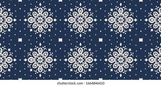 Ikat seamless pattern. Border with snowflakes. Openwork lace. New year Christmas background. Vector tie dye shibori print with stripes and chevron. Ink textured japanese background. Bohemian fashion. 