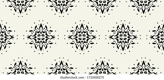 Ikat seamless pattern. Border with snowflakes. Openwork lace. New year Christmas background. Vector tie dye shibori print with stripes and chevron. Ink textured japanese background. Bohemian fashion. 