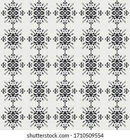 Ikat seamless pattern. Border with snowflakes. Openwork lace. New year Christmas background. Vector tie dye shibori print with stripes and chevron. Ink textured japanese background. Bohemian fashion. 