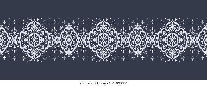 Ikat seamless pattern. Border with snowflakes. Openwork lace. New year Christmas background. Vector tie dye shibori print with stripes and chevron. Ink textured japanese background. Bohemian fashion. 