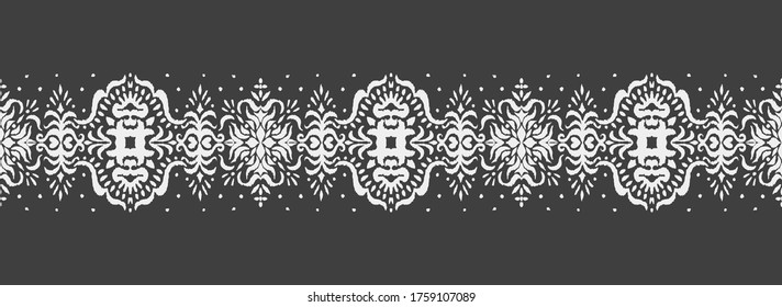 Ikat seamless pattern. Border with snowflakes. Openwork lace. New year Christmas background. Vector tie dye shibori print with stripes and chevron. Ink textured japanese background. Bohemian fashion. 