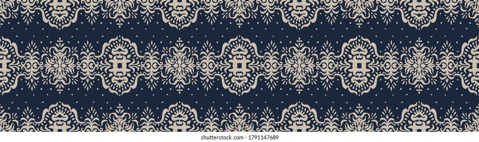 Ikat seamless pattern. Border with snowflakes. Openwork lace. New year Christmas background. Vector tie dye shibori print with stripes and chevron. Ink textured japanese background. Bohemian fashion. 