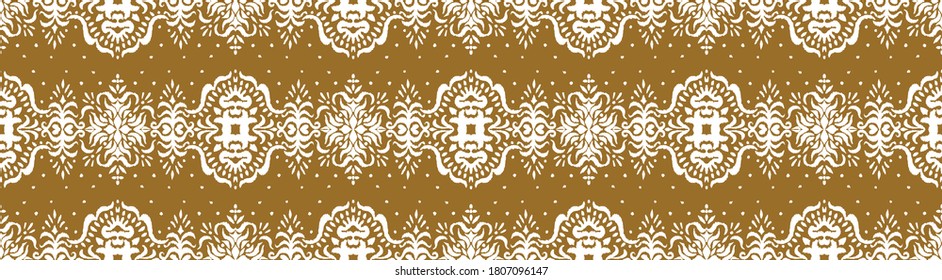 Ikat seamless pattern. Border with snowflakes. Openwork lace. New year Christmas background. Vector tie dye shibori print with stripes and chevron. Ink textured japanese background. Bohemian fashion. 