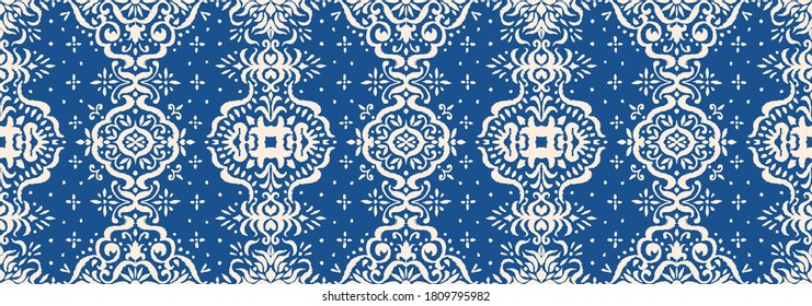 Ikat seamless pattern. Border with snowflakes. Openwork lace. New year Christmas background. Vector tie dye shibori print with stripes and chevron. Ink textured japanese background. Bohemian fashion. 