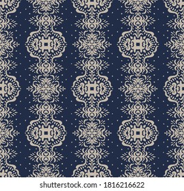 Ikat seamless pattern. Border with snowflakes. Openwork lace. New year Christmas background. Vector tie dye shibori print with stripes and chevron. Ink textured japanese background. Bohemian fashion. 
