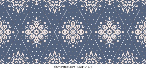 Ikat seamless pattern. Border with snowflakes. Openwork lace. New year Christmas background. Vector tie dye shibori print with stripes and chevron. Ink textured japanese background. Bohemian fashion. 