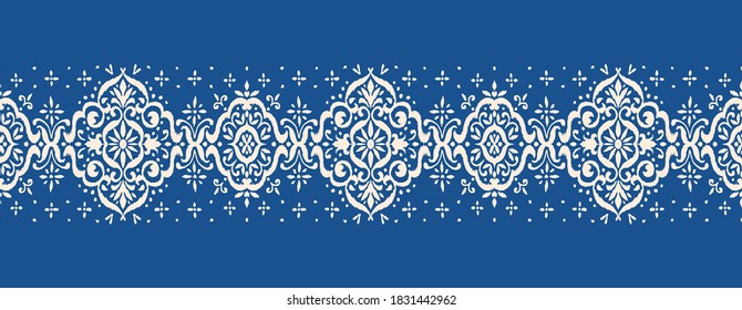 Ikat seamless pattern. Border with snowflakes. Openwork lace. New year Christmas background. Vector tie dye shibori print with stripes and chevron. Ink textured japanese background. Bohemian fashion. 