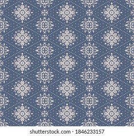 Ikat seamless pattern. Border with snowflakes. Openwork lace. New year Christmas background. Vector tie dye shibori print with stripes and chevron. Ink textured japanese background. Bohemian fashion. 