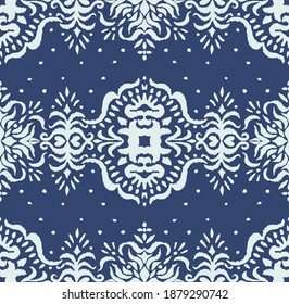 Ikat seamless pattern. Border with snowflakes. Openwork lace. New year Christmas background. Vector tie dye shibori print with stripes and chevron. Ink textured japanese background. Bohemian fashion. 