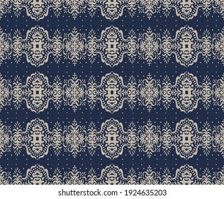 Ikat seamless pattern. Border with snowflakes. Openwork lace. New year Christmas background. Vector tie dye shibori print with stripes and chevron. Ink textured japanese background. Bohemian fashion. 