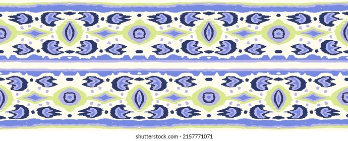 Ikat seamless pattern. Border with snowflakes. Openwork lace. New year Christmas background. Vector tie dye shibori print with stripes and chevron. Ink textured japanese background. Bohemian fashion.