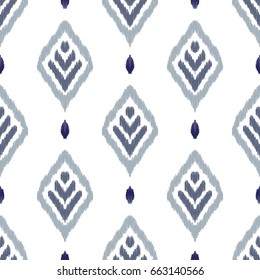 Ikat seamless pattern. Fancy textile design. Vector illustration in ethnic style.