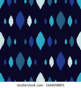 Ikat. Seamless pattern. Geometric background. Vector illustration for web design or print.