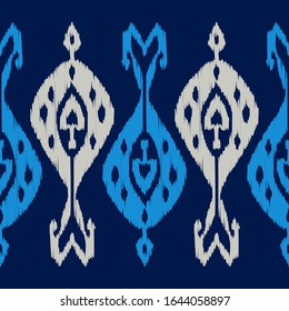 Ikat. Seamless pattern. Geometric background. Vector illustration for web design or print.