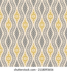 Ikat seamless pattern. Seamless hand drawn boho grey with yellow pattern. Ink textured japanese background. Modern batik wallpaper tile. Half white  background.