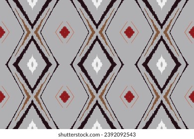 Ikat Seamless pattern paisley embroidery on white background.Ikat ethnic oriental seamless pattern traditional.Aztec style abstract vector illustration.design for texture,fabric,clothing,saree,sari