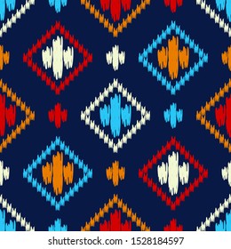 Ikat. Seamless pattern. Traditional ornament. Geometric background. Vector illustration for web design or print.