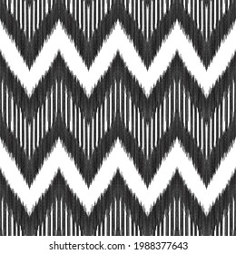 Ikat seamless pattern. Tribal background in black and white colors.   