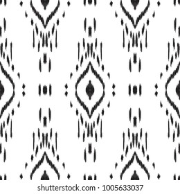 Ikat seamless pattern. Vector background. Black and white ethnic design for fashion textile prints, wallpapers, cards or wrapping papers.